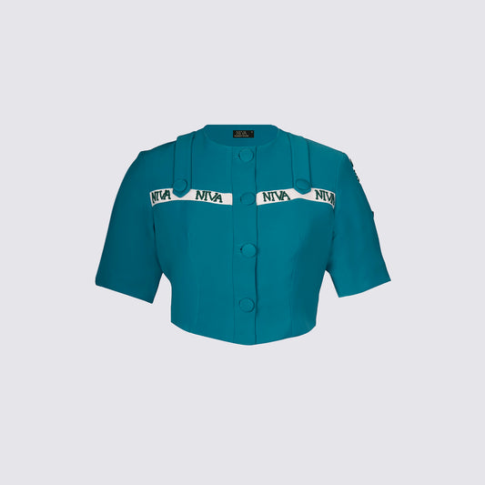 This Niva Embellished crop top featuring greatest styling of all times. Soft crepe fabric in captivating tone of teal green color with the highlights of nude niva embroidery piping used in an innovative way in all over this piece. Style it with matching pants from Niva and be ready for compliments amongst friends and colleagues.